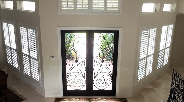 Salt Lake City foyer with glass doors and plantation shutters